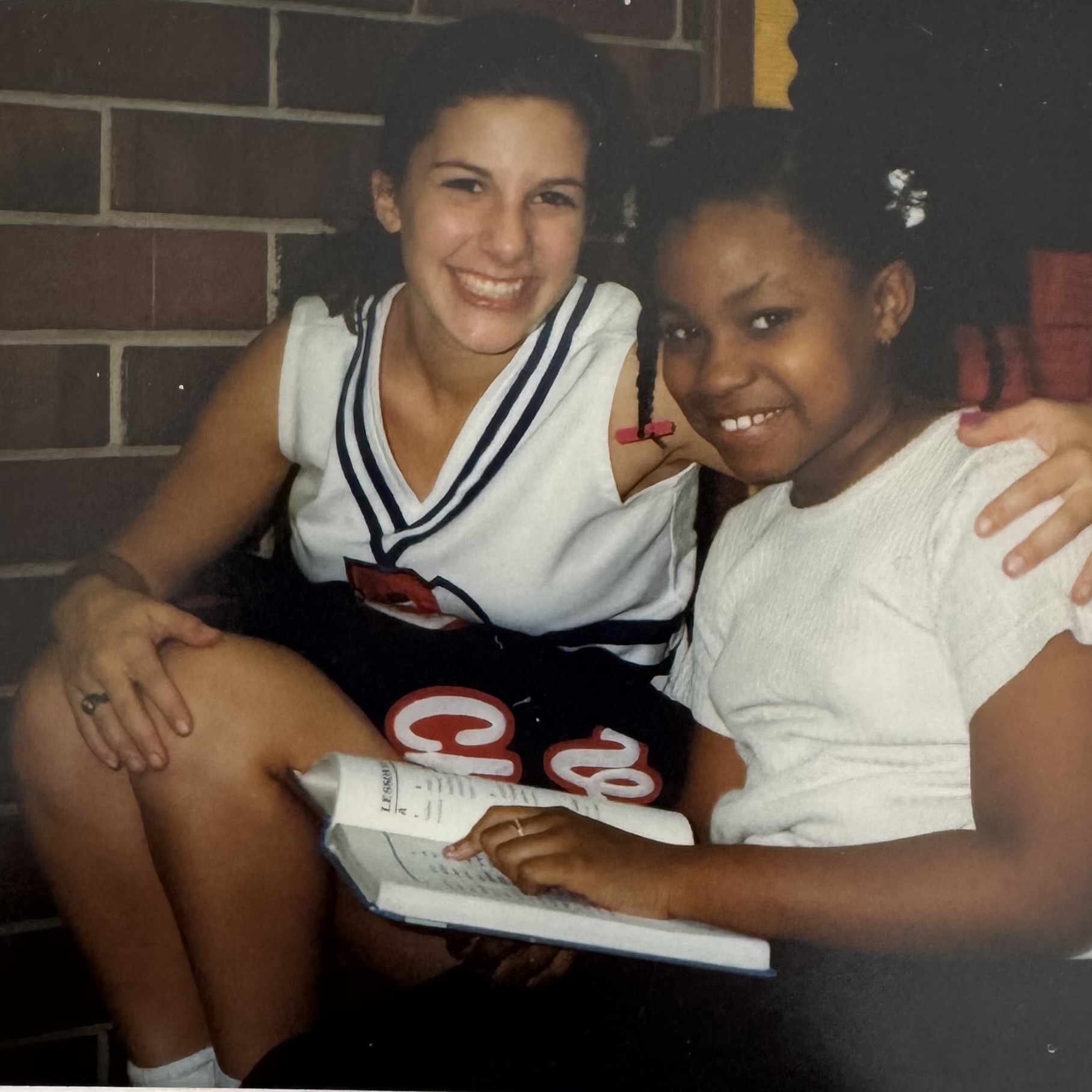 Quinn tutoring elementary students in 1996.